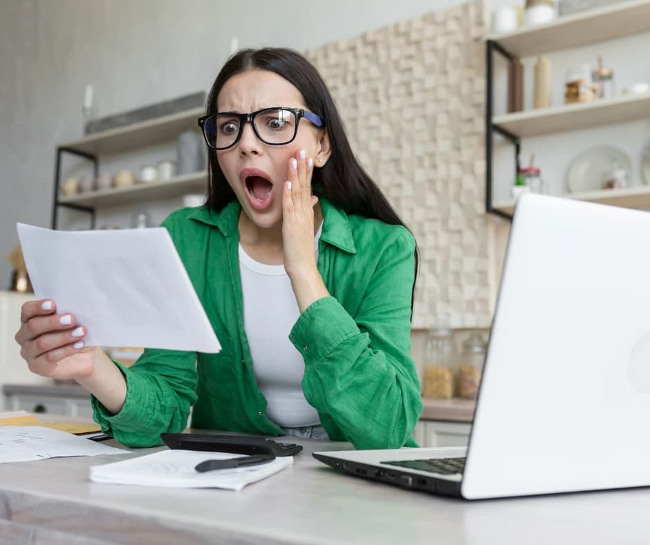 person-on-their-laptop-managing-the-impact-of-higher-interest-rates