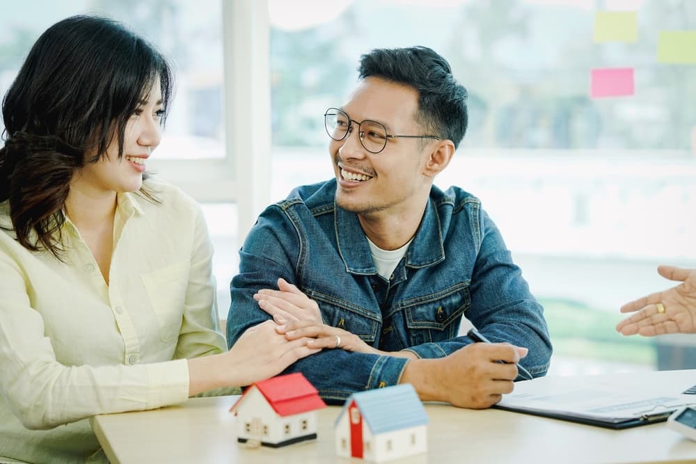 happy-couple-getting-aproved-for-a-loan