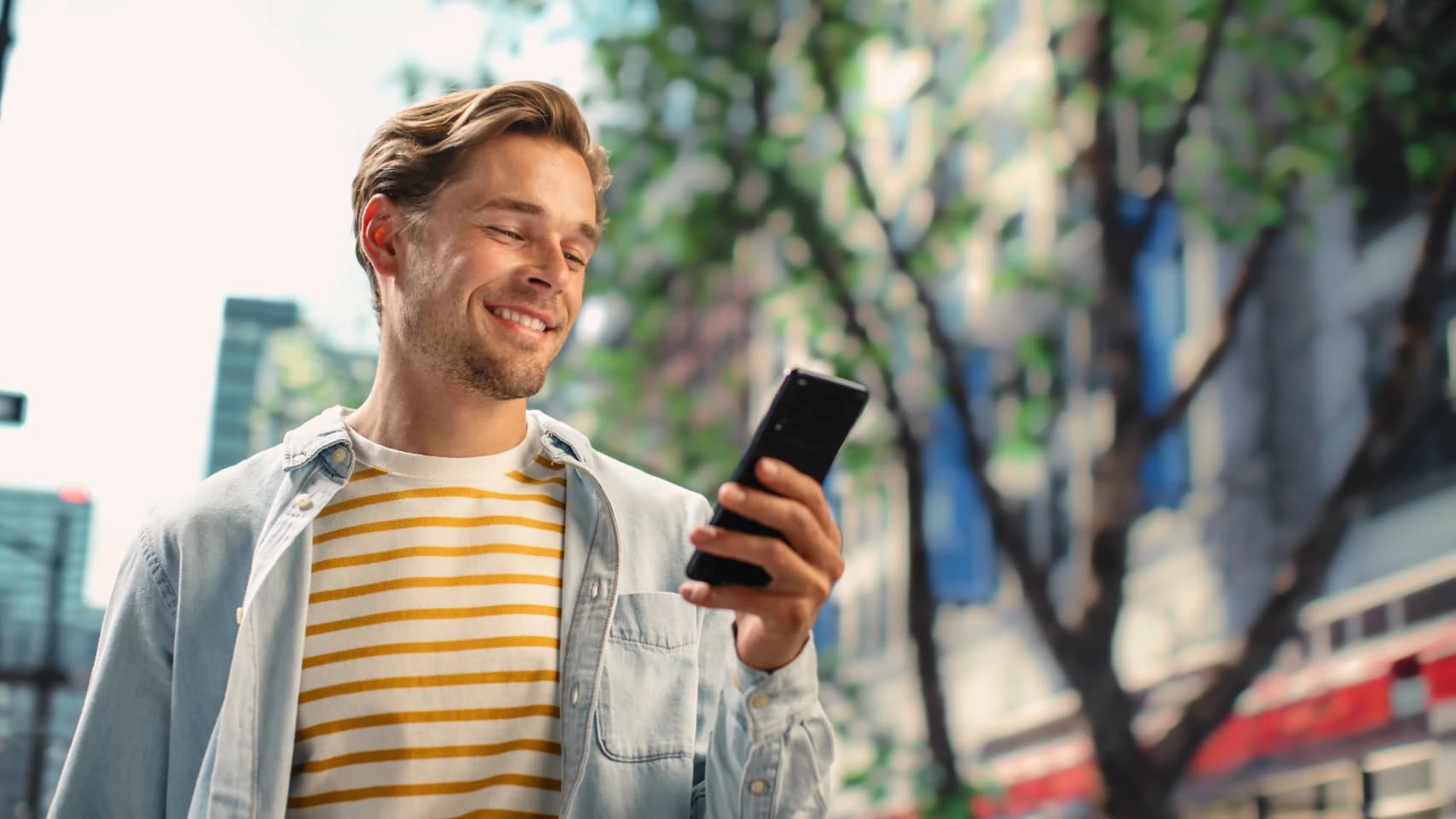 person-reviewing-payday-loan options-on-mobile-phone-in Alberta