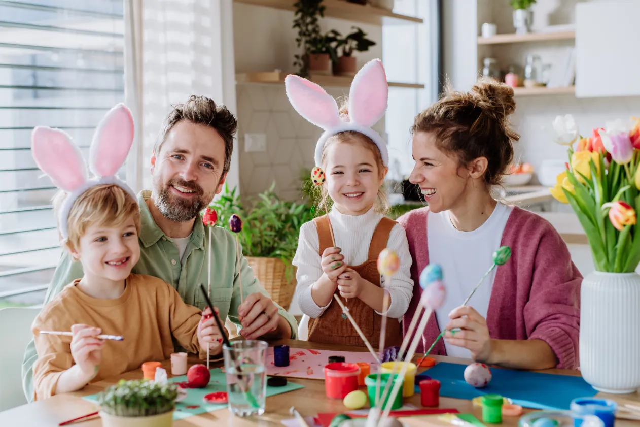 family-enjoying-colorful-easter-eggs-in-a-homemade-basket-surrounded-by-budget-friendly-decorations
