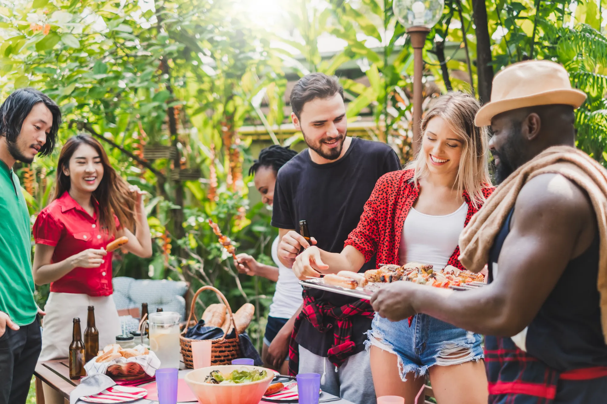 friends-enjoying-a-budget-friendly-backyard-bbq-with-grilled-food-colorful-decorations-and-summer-party-atmosphere