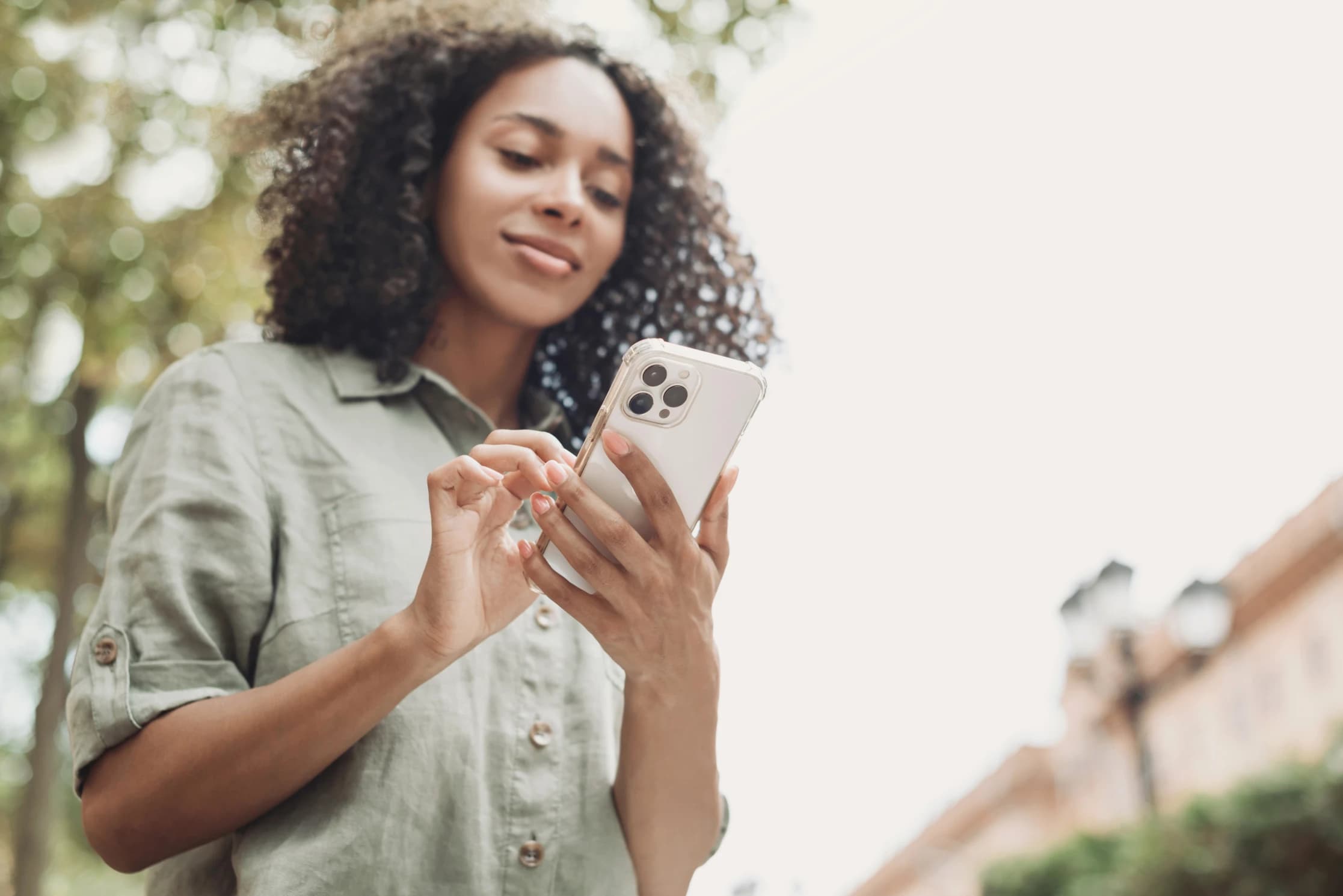 Woman using smartphone in a city