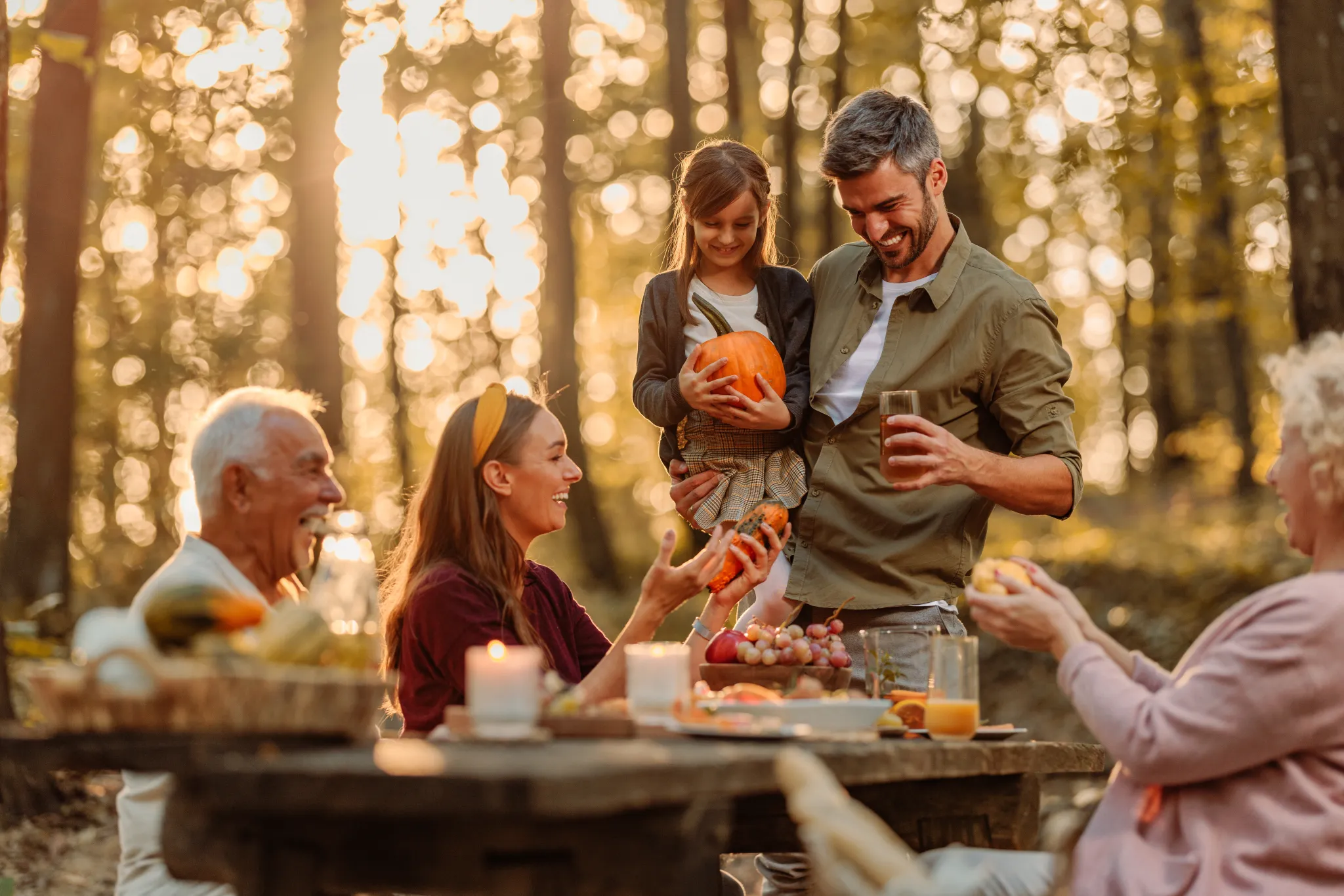 family-enjoying-affordable-fall-activities-at-pumpkin-patch-with-autumn-leaves-and-seasonal-decorations